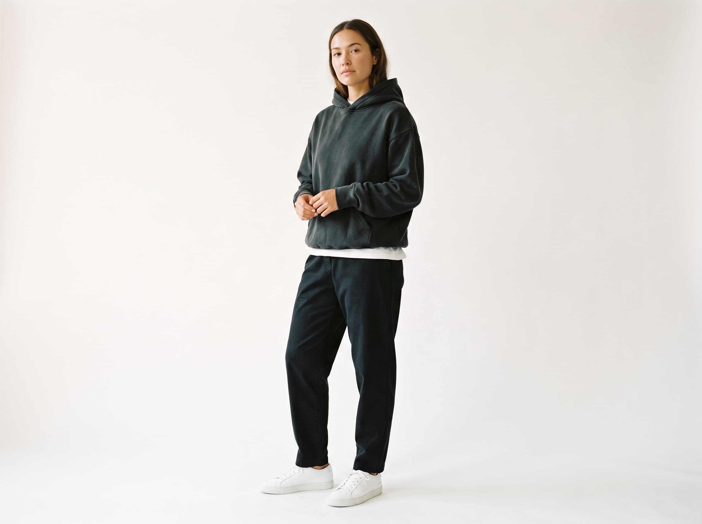 AI influencer in streetwear, an oversized hoodie with relaxed tapered trousers and clean sneakers